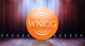 Wncg logo on a stage with spotlights.