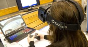 A girl wearing a headset playing a video game.