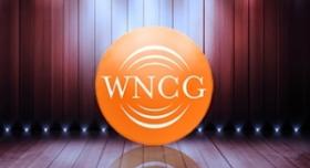 The wncg logo on a wooden stage.